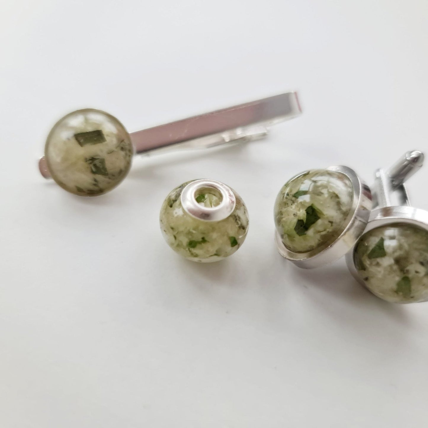 silver resin flower preservation cufflinks, charm and tie pin made with white and green flowers