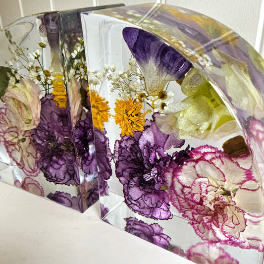 wedding bouquet preservation book ends with pink and purple tone flowers