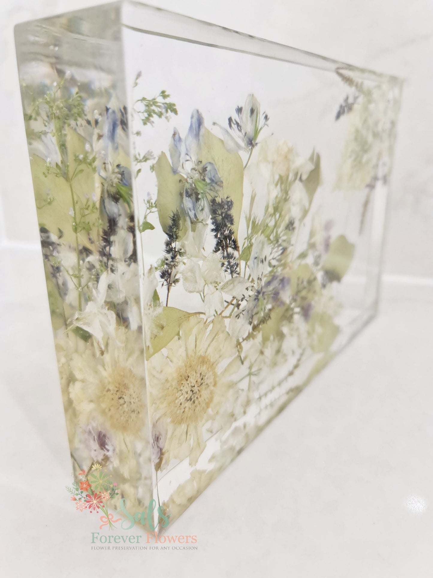 Decorative resin panel with floral design on a white background
