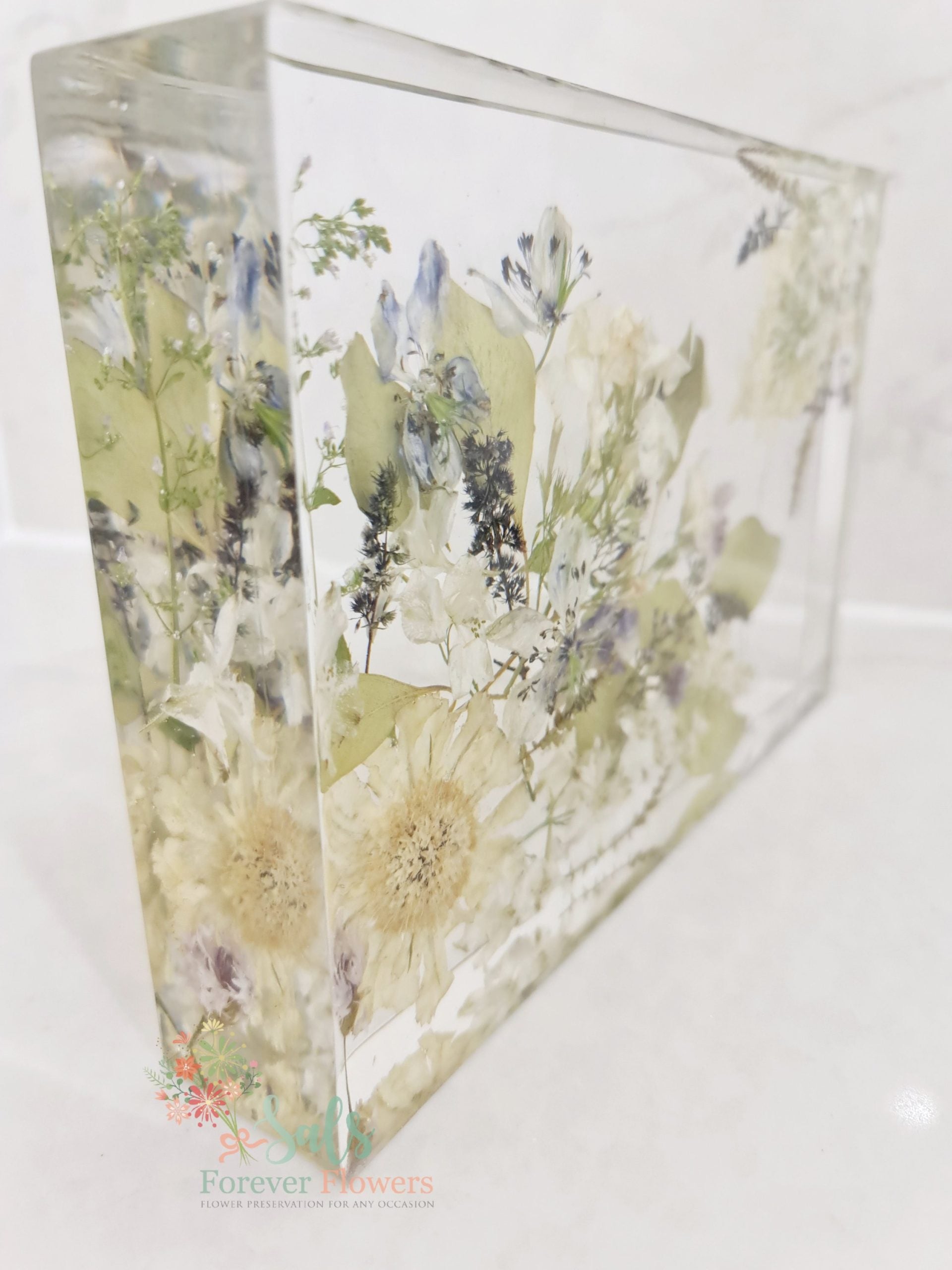 Decorative resin panel with floral design on a white background