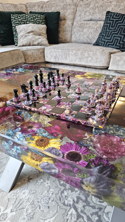 Flowers preserved in a resin coffee table with a resin flower preservation chess board placed ontop