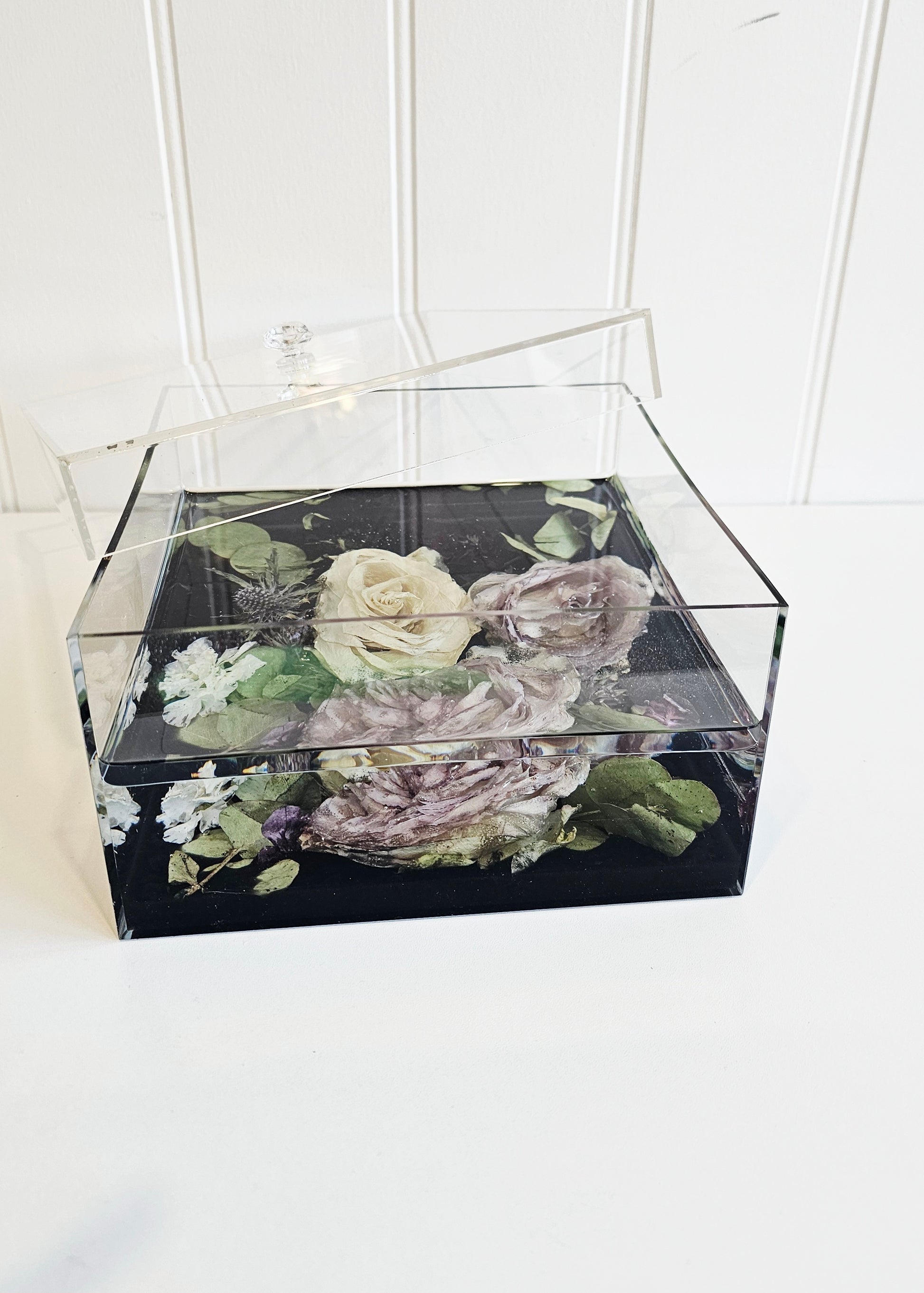 Clear resin rectangular box with floral design on a white background
