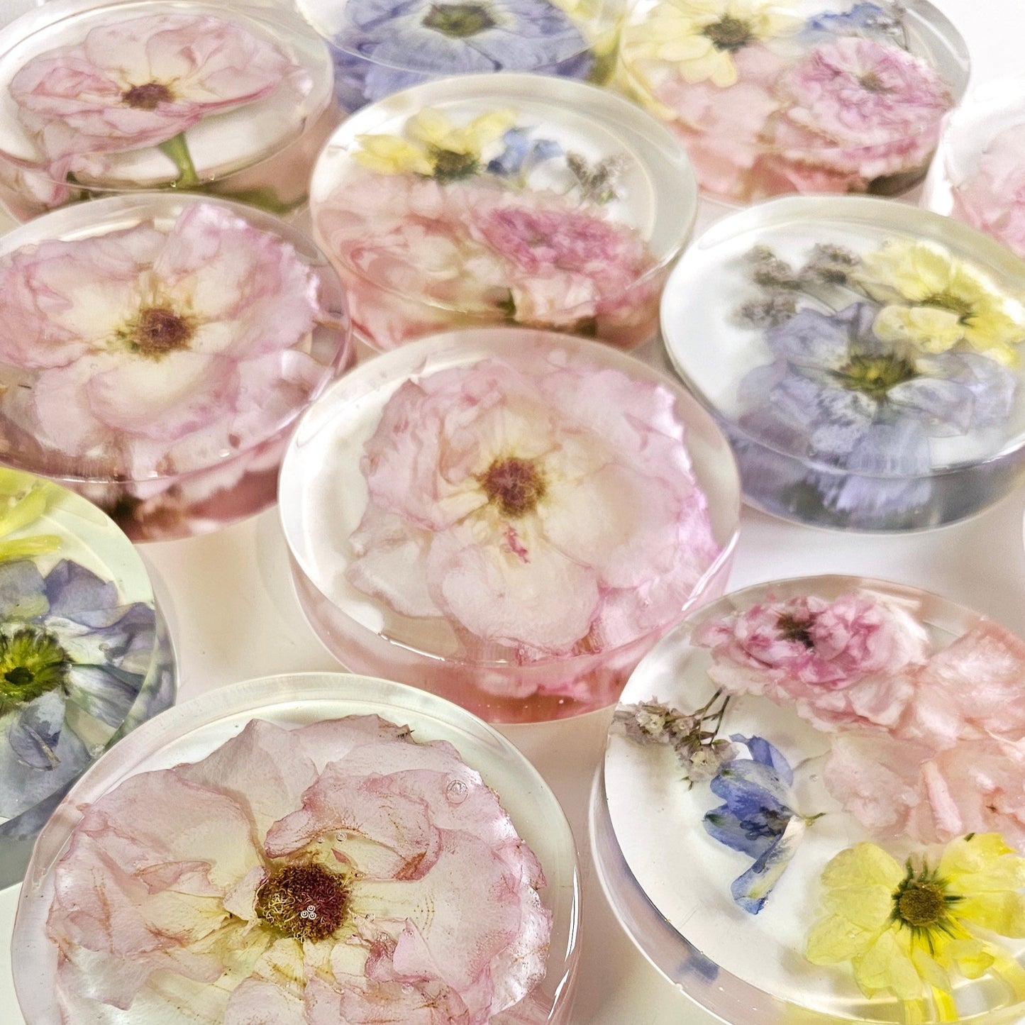 flower preservation resin coasters in a variety of colours 