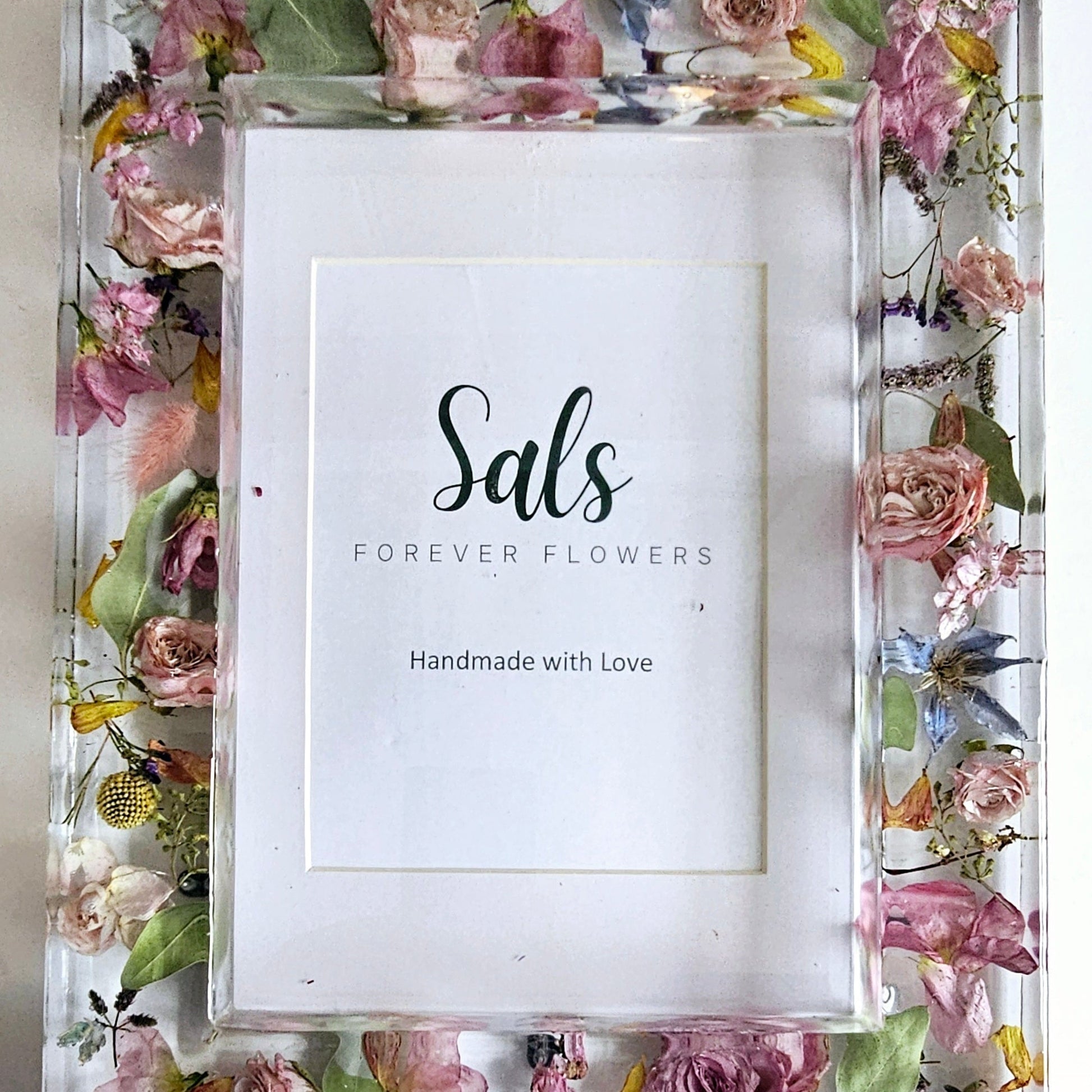 Floral frame with 'Sals Forever Flowers' branding on a white background