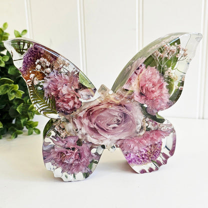 preserved funeral flowers in a butterfly shape resin ornament. a memorial keepsake front view

