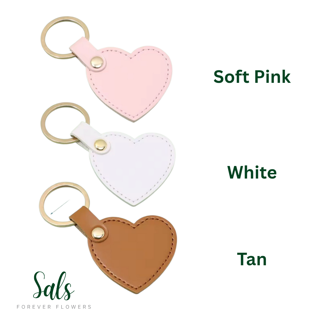 Heart-shaped keychains in soft pink, white, and tan with 'Sals Forever Flowers' branding.