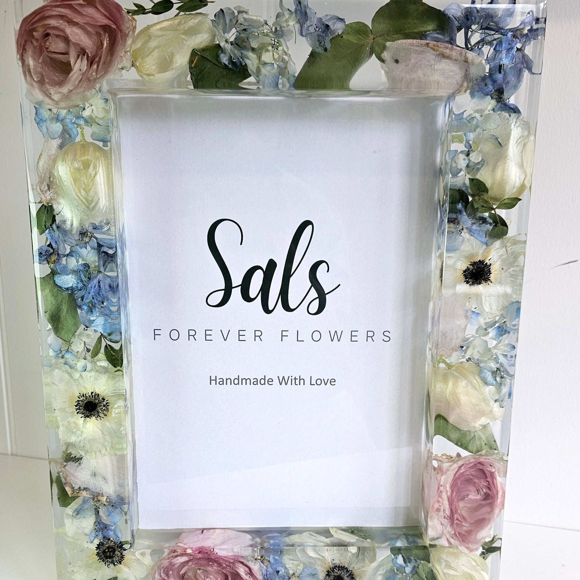 resin Floral photo frame with a white card inside displaying 'Sals Forever Flowers'.
