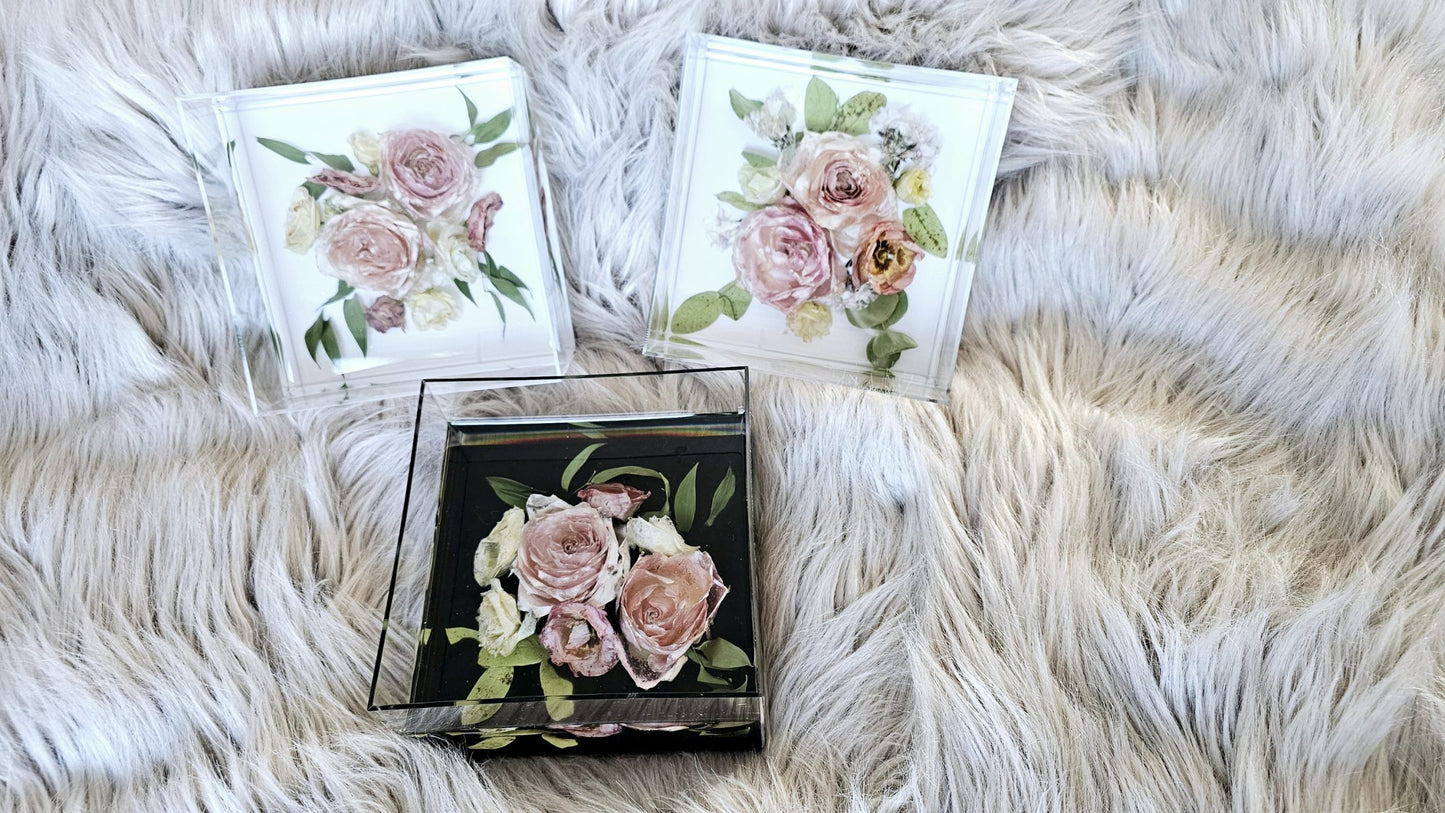 resin and floral keepsake boxes on fluffy background