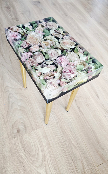 table with floral pattern on a wooden floor