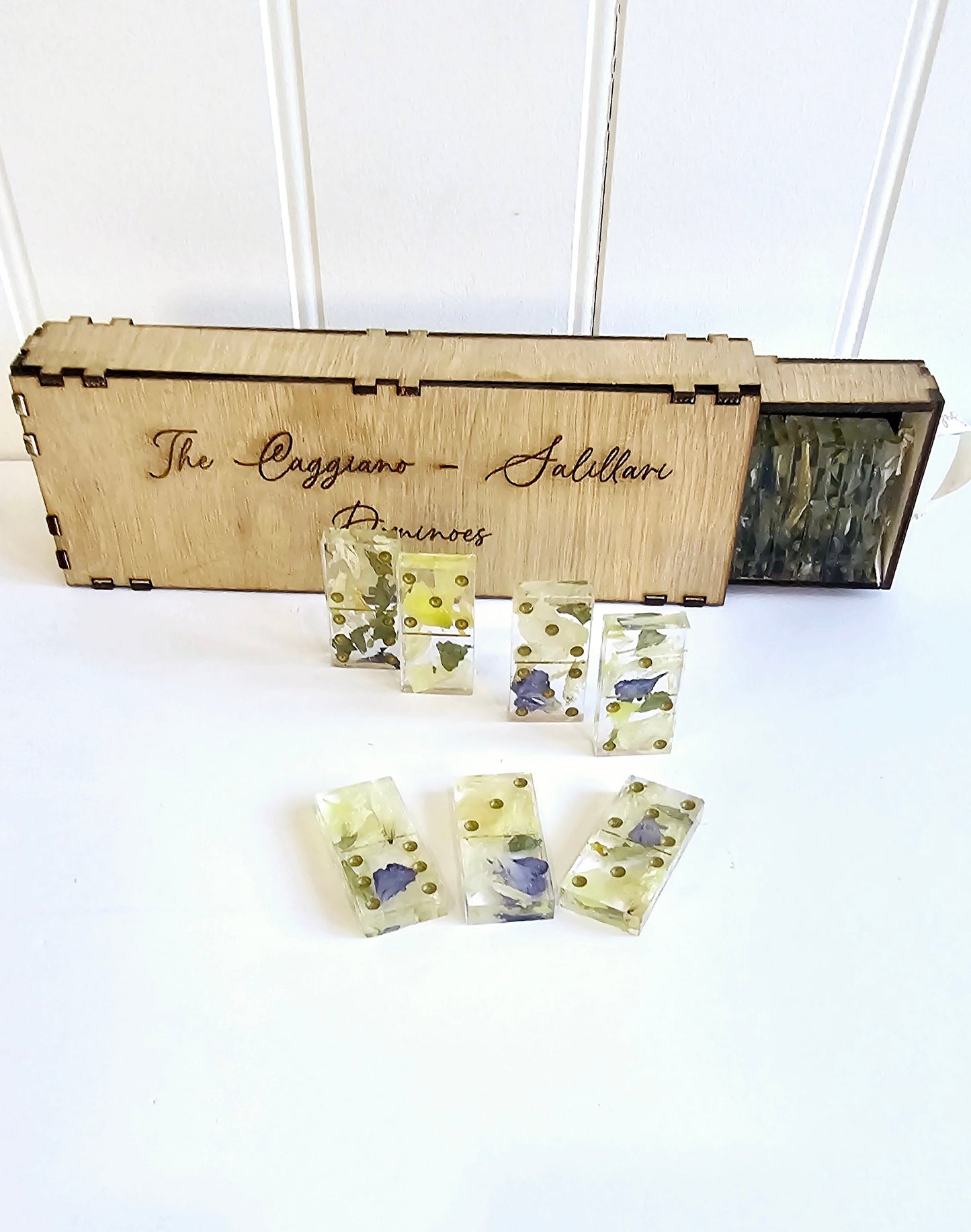 Set of floral soap bars in front of a wooden box labeled 'The Caggiano Salieri Pianoforte'.