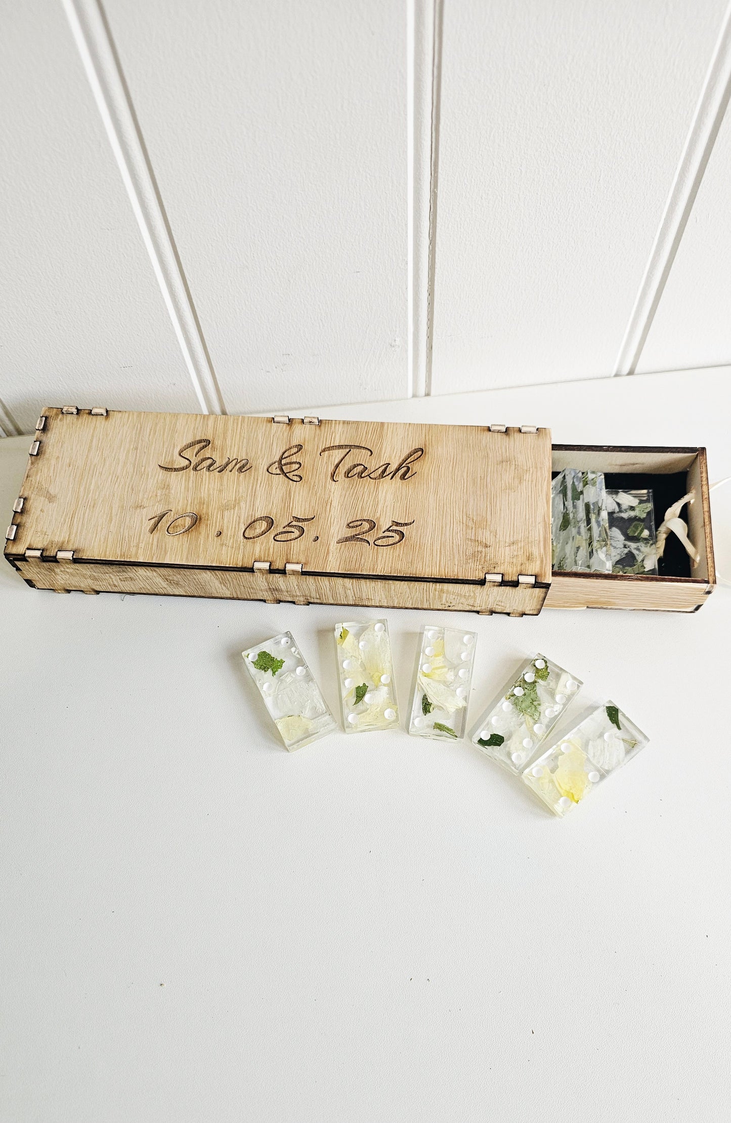 Set of clear resin cards with floral designs in a wooden box labeled 'Sam & Tash 10.05.25'.