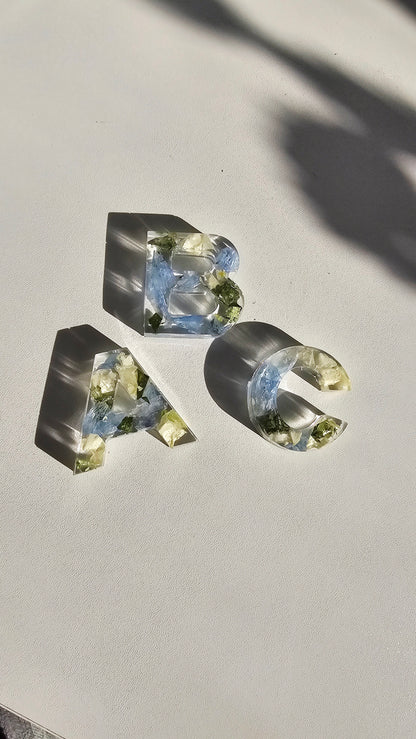 Crystal-like letters 'A', 'B', and 'C' on a light background