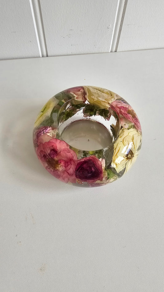 Decorative resin floral tealight holder  on a white background