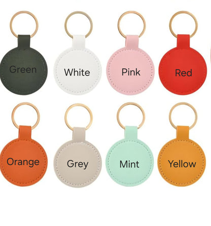 Set of round keychains in various colors with labels on a white background