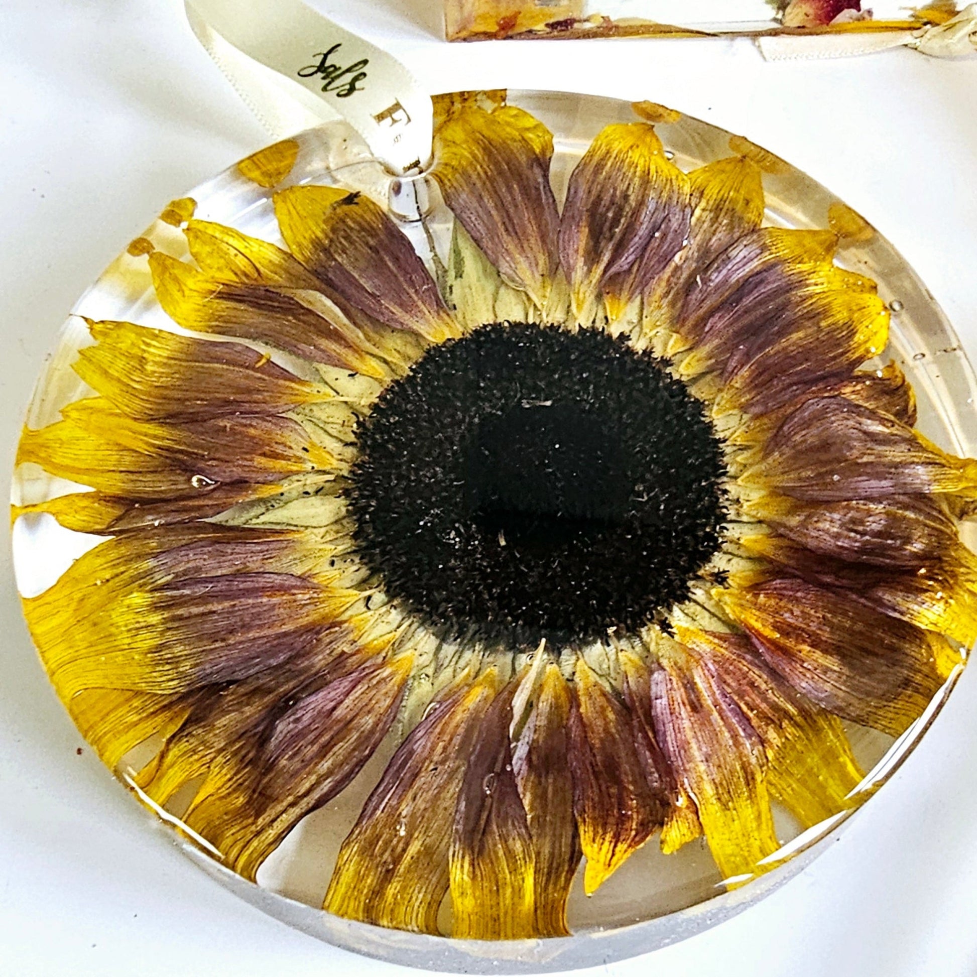 Sunflower-shaped decorative item on a white surface