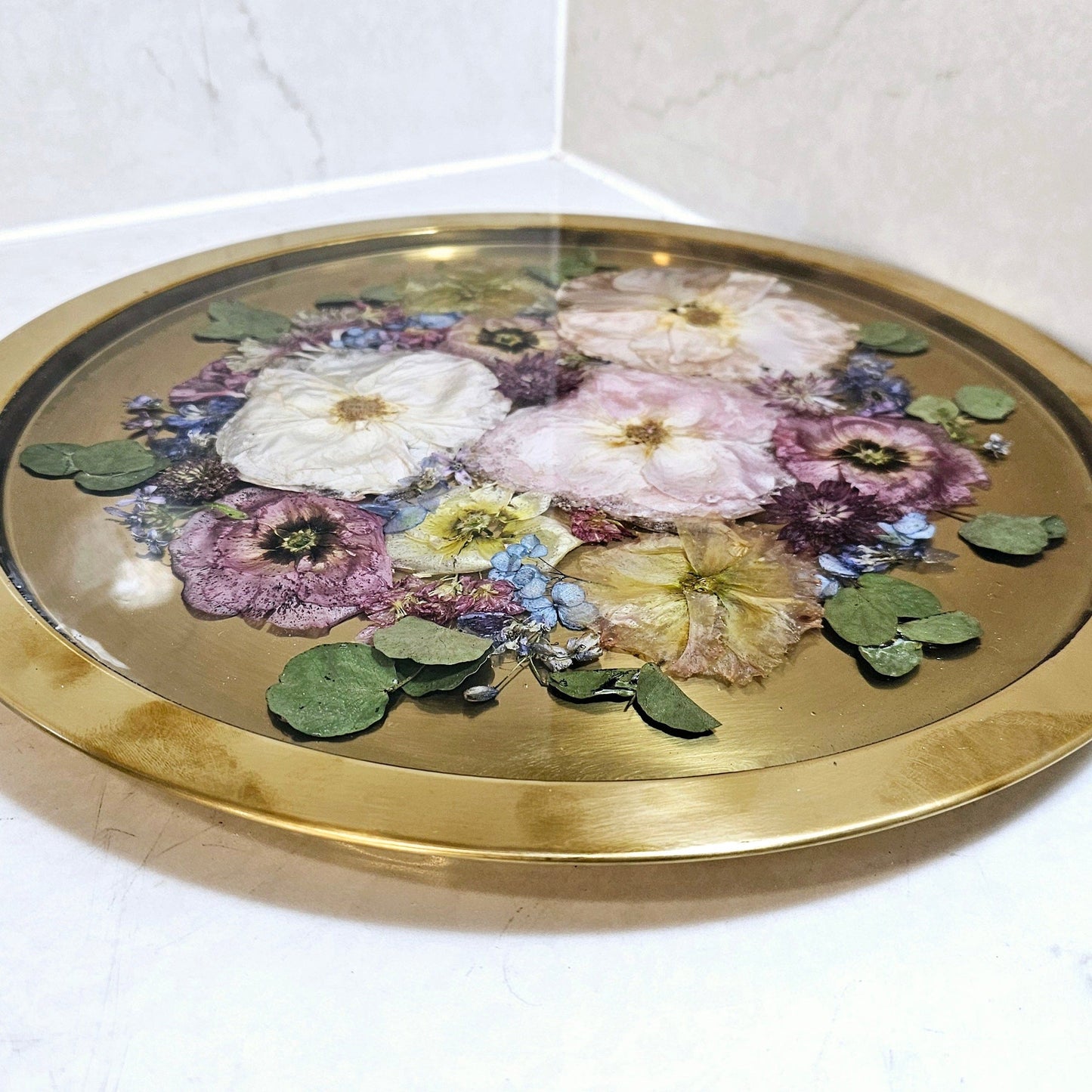 Decorative tray with floral design on a white surface