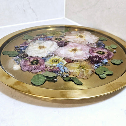 Decorative tray with floral design on a white surface