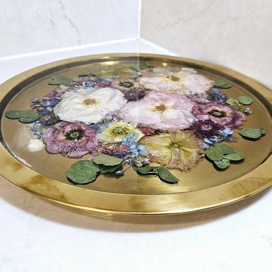 Decorative tray with floral design on a white surface