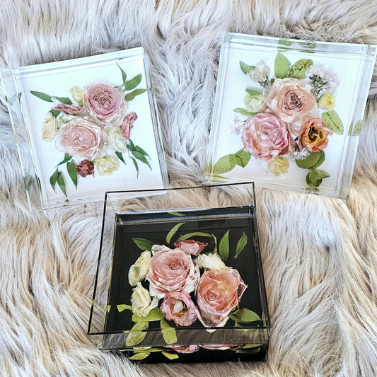Set of floral keepsake boxes on a fluffy white surface